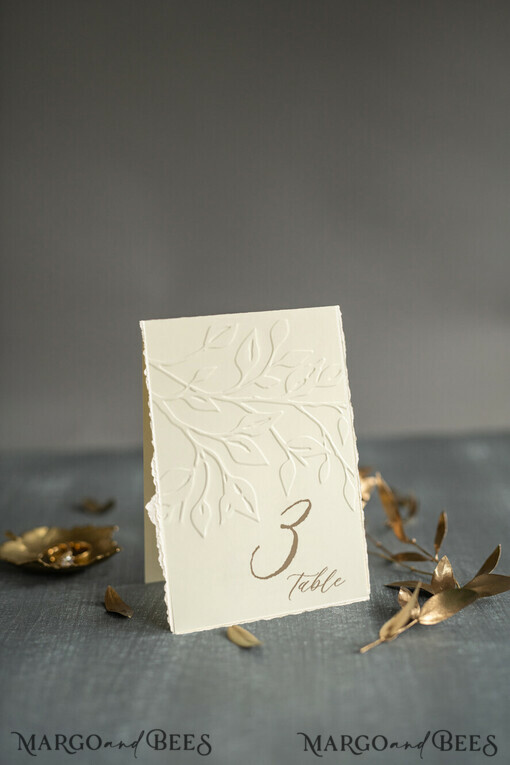 TABLE DECOR SIGNS glitter Elegant Wedding Table Number Card with Embossed Floral Design – Ivory Textured Paper, Folded Tent Style, Classic Font, Luxury Reception Decor